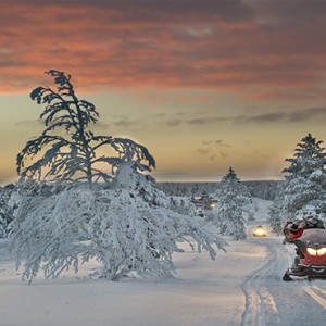 Kakslauttanen Arctic Resort - Luxury Finland Honeymoon Packages - snow mobiling
