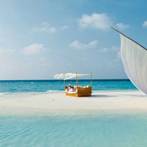 Baros Maldives - Luxury Maldives Honeymoon Packages - Relaxing on sandbank cabana