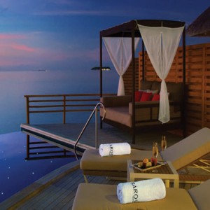 Baros Maldives - Luxury Maldives Honeymoon Packages - Water Pool Villas at sunset