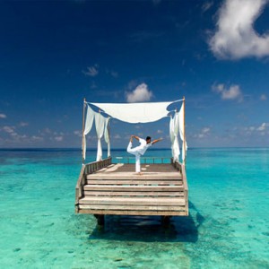 Baros Maldives - Luxury Maldives Honeymoon Packages - Yoga on piano deck