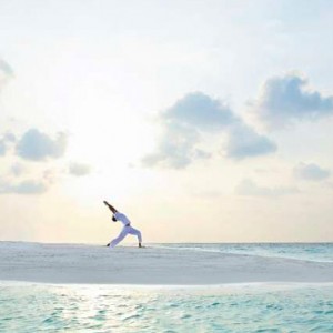 Baros Maldives - Luxury Maldives Honeymoon Packages - Yoga on sandbank