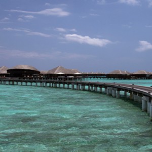 Coco Bodu Hithi - Luxury Maldives Honeymoon Packages - Coco Residence walkway to residence