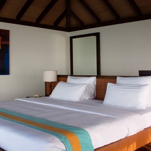 Coco Bodu Hithi - Luxury Maldives Honeymoon Packages - Escape Water Villa bedroom overview