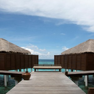Coco Bodu Hithi - Luxury Maldives Honeymoon Packages - Escape Water Villa exterior walkway