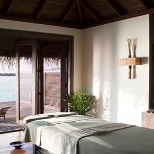 Coco Bodu Hithi - Luxury Maldives Honeymoon Packages - Spa massage room1