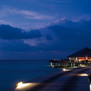 Coco Bodu Hithi - Luxury Maldives Honeymoon Packages - Stars restaurant exterior at night