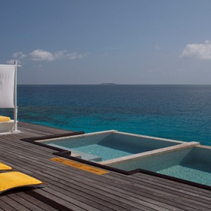 Coco Bodu Hithi - Luxury Maldives Honeymoon Packages - spa deck and pool