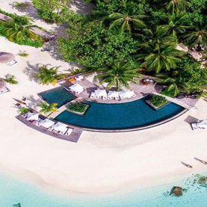 Constance Moofushi - Luxury Maldives Honeymoon Packages - Aerial View of Pool and beach