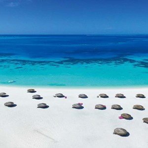 Constance Moofushi - Luxury Maldives Honeymoon Packages - Aerial View of beach and ocean