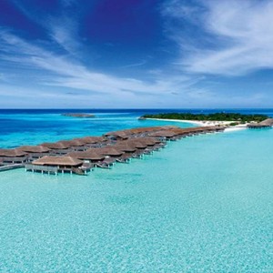 Constance Moofushi - Luxury Maldives Honeymoon Packages - Aerial View of water villas