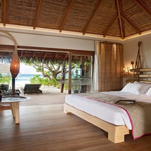 Constance Moofushi - Luxury Maldives Honeymoon Packages - Beach Villa bedroom