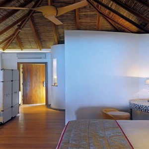 Constance Moofushi - Luxury Maldives Honeymoon Packages - Beach Villa bedroom1