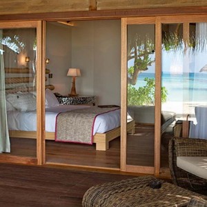 Constance Moofushi - Luxury Maldives Honeymoon Packages - Beach Villa deck view