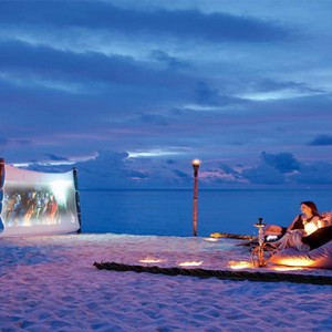 Constance Moofushi - Luxury Maldives Honeymoon Packages - Beach cinema1