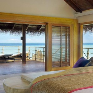 Constance Moofushi - Luxury Maldives Honeymoon Packages - Senior Water Villa bedroom view