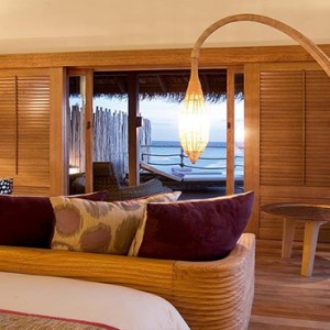 Constance Moofushi - Luxury Maldives Honeymoon Packages - Senior Water Villa bedroom1