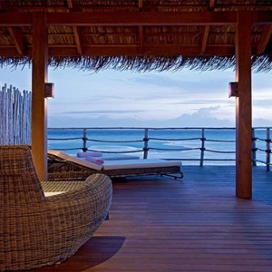 Constance Moofushi - Luxury Maldives Honeymoon Packages - Senior Water Villa deck at night