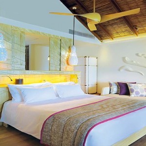 Constance Moofushi - Luxury Maldives Honeymoon Packages - Water Villa Bedroom overview