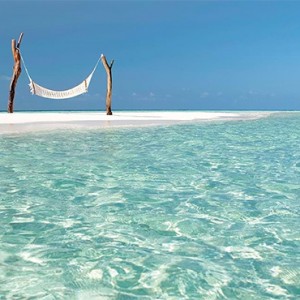 Constance Moofushi - Luxury Maldives Honeymoon Packages - hammock on the beach