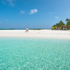 Diamonds Athuruga - Luxury Maldives Honeymoon Packages - Romantic stroll on beach