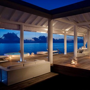 Diamonds Athuruga - Luxury Maldives Honeymoon Packages - Two Bedroom Water Villa deck at night