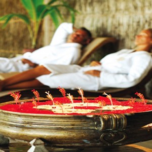 Diamonds Athuruga - Luxury Maldives Honeymoon Packages - couple relaxing spa