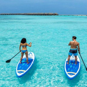 Hurawalhi Island - Luxury Maldives Honeymoon Packages - Paddleboarding