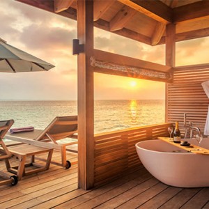 Hurawalhi Island - Luxury Maldives Honeymoon Packages - Romantic Ocean Villas bathtub and deck with view