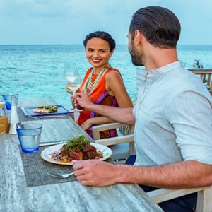 Hurawalhi Island - Luxury Maldives Honeymoon Packages - dining by sea