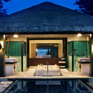 JA Manafaru - Luxury Maldives Honeymoon Packages - Beach Bungalows with Private Pools at night