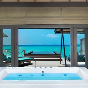 JA Manafaru - Luxury Maldives Honeymoon Packages - Sunset water villas with infinity pools bathroom