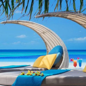 JA Manafaru - Luxury Maldives honeymoon packages - Infinity Bar and Pool seating area