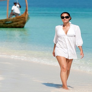 JA Manafaru - Luxury Maldives honeymoon packages - castaway island women on beach