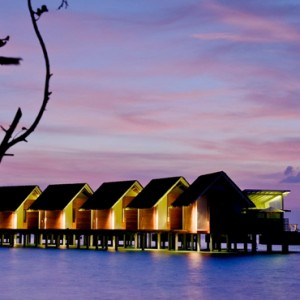 Kandolhu Maldives - Luxury Maldives Honeymoon Packages - overwater villas at night