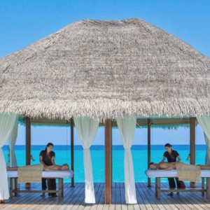 Kuramathi Maldives - Luxury Maldives Honeymoon Packages - couple spa massage over the lagoon