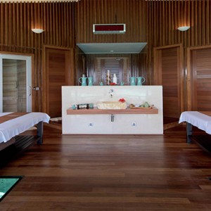 Lily Beach Resort and Spa at Huvahendhoo - Luxury Maldives Honeymoon Packages - Couple Spa room with glass floor