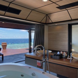 Lily Beach Resort and Spa at Huvahendhoo - Luxury Maldives Honeymoon Packages - Deluxe Water Villa bathroom view