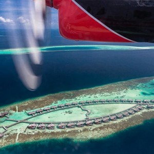 Lily Beach Resort and Spa at Huvahendhoo - Luxury Maldives Honeymoon Packages - Deluxe Water Villa seaplane transfer view