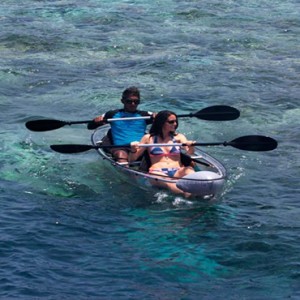 Lily Beach Resort and Spa at Huvahendhoo - Luxury Maldives Honeymoon Packages - Glass Canoe