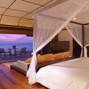 Lily Beach Resort and Spa at Huvahendhoo - Luxury Maldives Honeymoon Packages - Sunset Water Suite bedroom