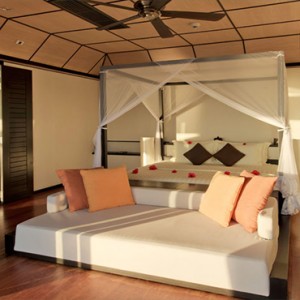 Lily Beach Resort and Spa at Huvahendhoo - Luxury Maldives Honeymoon Packages - Sunset Water Suite bedroom1