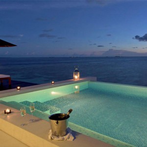 Lily Beach Resort and Spa at Huvahendhoo - Luxury Maldives Honeymoon Packages - Sunset Water Suite pool at night