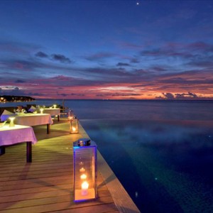 Lily Beach Resort and Spa at Huvahendhoo - Luxury Maldives Honeymoon Packages - aqva at night