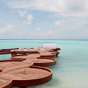 Lux South Ari Atoll - Luxury Maldives Honeymoon Packages - Seating area over lagoon