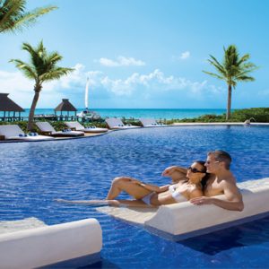 Mexico Honeymoon Packages Zoetry Paraiso De La Bonita Riviera Maya Couple Relaxing In Pool