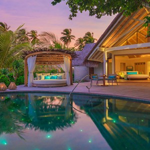 Milaidhoo Island Maldives - Luxury Maldives Honeymoon Packages - Beach Pool Villas exterior at night