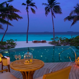 Milaidhoo Island Maldives - Luxury Maldives Honeymoon Packages - Beach Pool Villas exterior view at night