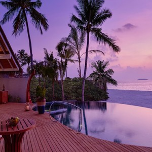 Milaidhoo Island Maldives - Luxury Maldives Honeymoon Packages - Beach Residence pool deck at night