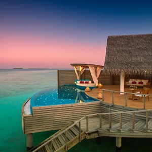 Milaidhoo Island Maldives - Luxury Maldives Honeymoon Packages - Water Pool Villa exterior at night