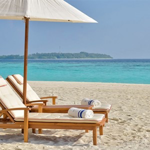 Milaidhoo Island Maldives - Luxury Maldives Honeymoon Packages - beach loungers